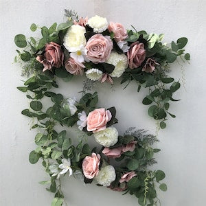 Artificial floral swag for wedding arch with eucalyptus leaves and dusty pink blush roses
