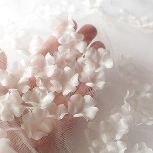 White 3D fabric flower petal appliques on sheer backing