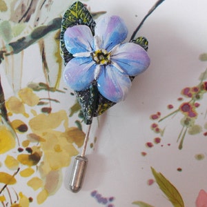Handmade blue and purple floral lapel pin with metal clutch backing