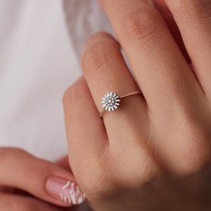 Dainty 14k yellow gold flower ring with small round diamond-like stones