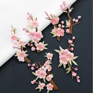 Embroidered iron-on cherry blossom flower patches, pink blooms with green leaves and stems