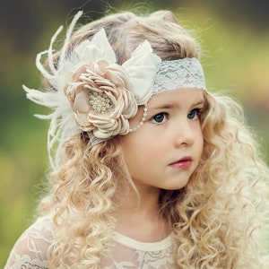 Baby girl headband with ivory fabric flower and jeweled center, soft feather accents