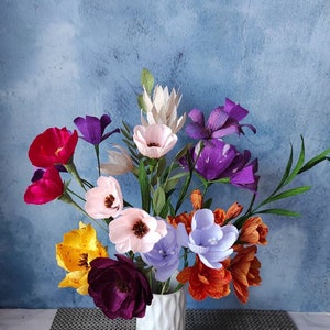 Mixed crepe paper flower bouquet in vase, pink, purple, orange and blue blooms