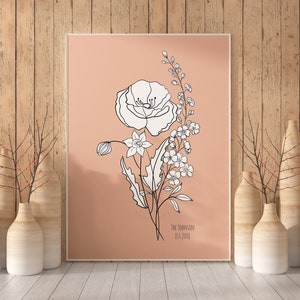 Framed wildflower bouquet wall art with line-drawn flower and small text