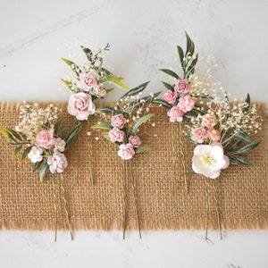 Pink flower bridal hair pins with greenery, decorative blooms on metal comb