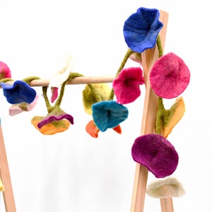 Multicolor wool felt flower garland with large pink, blue, purple and green blossoms
