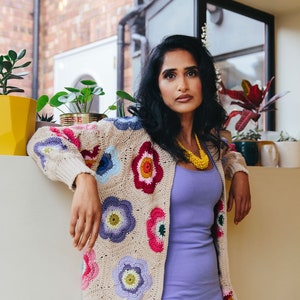 Crochet cardigan with multicolor flower appliques and long sleeves, open front