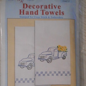 Pair of white kitchen hand towels with stamped embroidery design: farm truck and sunflowers