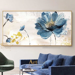 Framed canvas art with beige background, large blue flower and bird, landscape