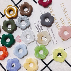 Set of flower-shaped resin charm pendants with hollow centers in assorted fresh colors