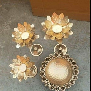 Floral diya candle stand set with three flower holders and a round metal base
