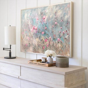 Abstract floral oil painting on canvas with pink blossoms and light pastel background
