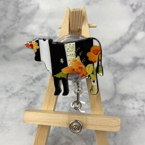 Black and white floral nurse badge reel with retractable clip and clasp
