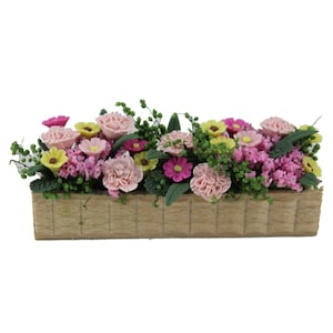 Miniature dollhouse flower planter with pink and purple clay blossoms