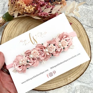 Pink floral baby headband with layered roses and small leaves