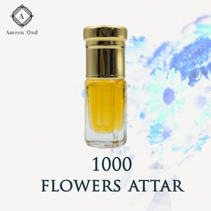 Perfume oil attar bottle with clear glass and gold cap, yellow liquid inside