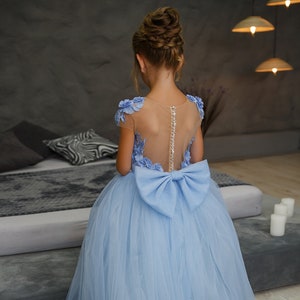 Light blue tulle ball gown dress with puff sleeves and open-back lace-up bodice