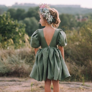 Sage green linen dress with puff sleeves and gathered waist, open back
