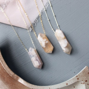 Crystal point agate necklace with pale pink stone pendants on gold-tone chains