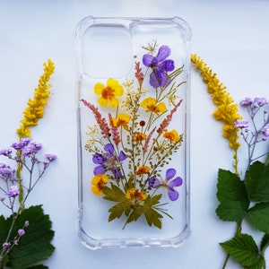 Clear phone case with pressed purple and yellow flowers