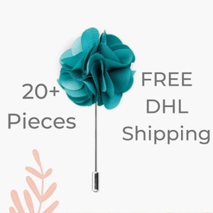 Turquoise fabric flower lapel pin with a slender pin backing