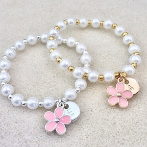 Kids pearl beaded bracelet with pink flower charm and gold accent beads