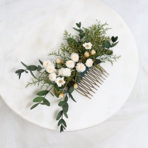 Bridal hair comb with preserved white flowers and green foliage, floral side comb