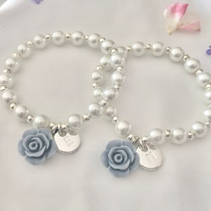 Kids flower charm bracelet with light blue rose beads and round pearl-like beads