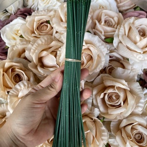 Artificial rose flower stems with green wrapped stems and cream petals