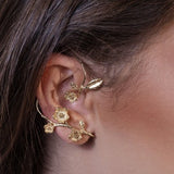 Gold-tone flower and leaf ear cuffs set for non-pierced ear, layered on one ear
