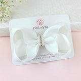 White satin flower girl hair bow with pearl and rhinestone center
