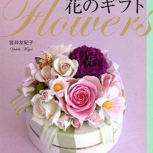 Soft clay flowers craft book featuring pastel rose and purple flower arrangement