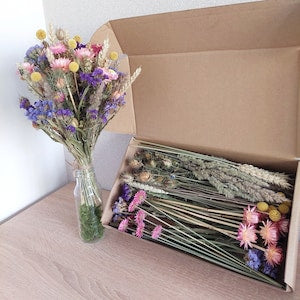 Glass vase with dried wildflower bouquet, pastel purple, pink, and yellow; stems included