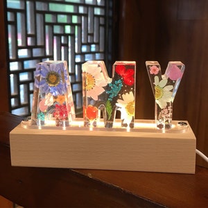Resin pressed-flower night light letters and symbols on display stand