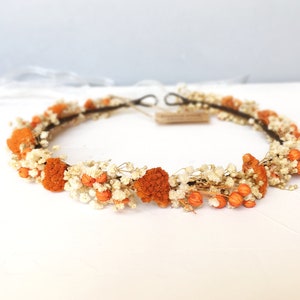 Rust orange dried flower crown with small cream baby's breath accents
