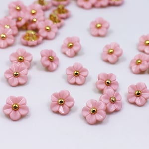 Pink flower-shaped buttons with gold centers, small floral button set for sewing