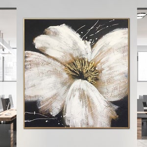 Abstract flower canvas painting with white petals and gold leaf on dark background