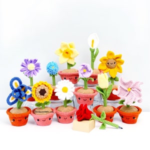 Crochet flower pen set with colorful blossoms in small potted stands