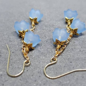 Light blue flower drop earrings with gold-tone chain and hypoallergenic ear wires