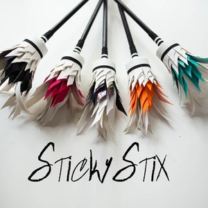 Flower sticks with silicone grip: black wands with multicolor feather tassel tips