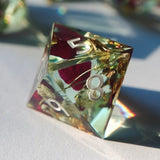 Resin RPG die with floral inclusions, showing the number 8