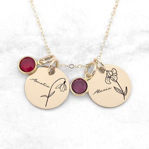 Gold-tone birth flower disc necklace with two round pendants and red gemstones