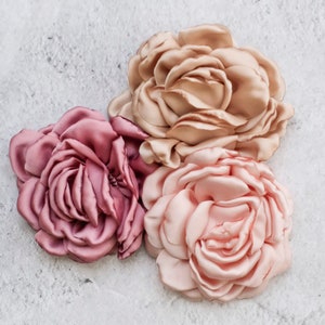 Three artificial satin fabric rose flowers, blush and dusty pink