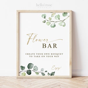 Flower bar printable sign with eucalyptus greenery and gold lettering in a wood frame