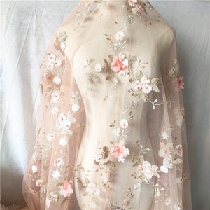 Sheer tulle lace fabric with 3D floral embroidery in light pink and white