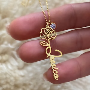 Gold-tone rose flower and blue birthstone name pendant necklace on fine chain