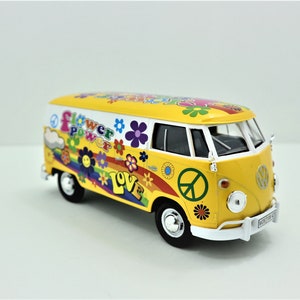 Volkswagen Type 2 die-cast delivery van, yellow with flower power graphics, front 3/4