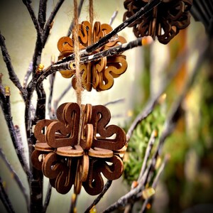 Wooden flower-shaped tree decoration with cutout design