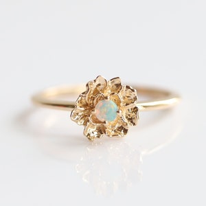 14k gold peony flower ring with round opal center and small floral petals