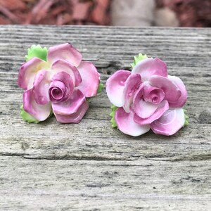 Handmade floral screw-back earrings with pink rose blossoms and green leaves, vintage pair